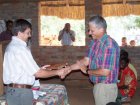 Pastor Frits receives a leather copy of the Makhua New Testament